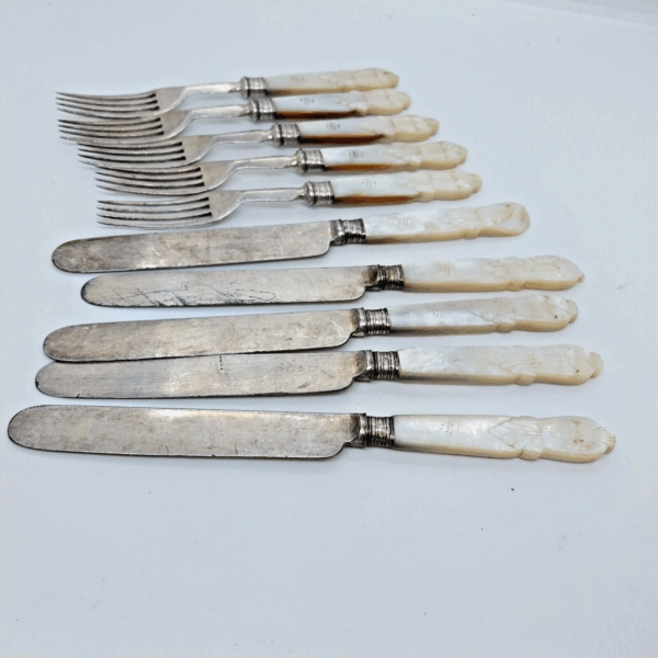 Vintage mother of pearl silverware set with silver-plated knives and forks